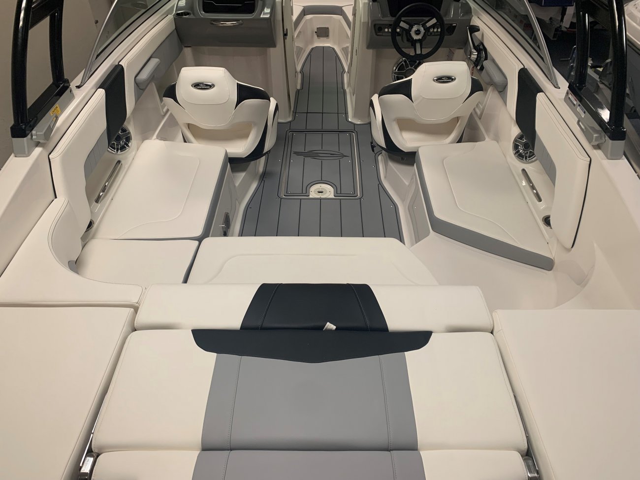 Wakeboarders want a giant wake to launch from as they cross from left to right behind the boat. With the engine set back against the transom, these boats carve a steep, large wake that riders love.