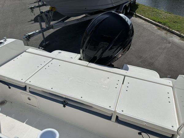 Glass fibers either loose or woven, reinforced with resin and used in the construction of many boats.