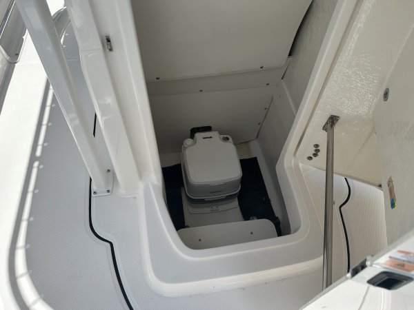 The definition of an outboard motor is a detachable engine mounted on outboard brackets on the stern of your boat.  This configuration will have only one single engine.