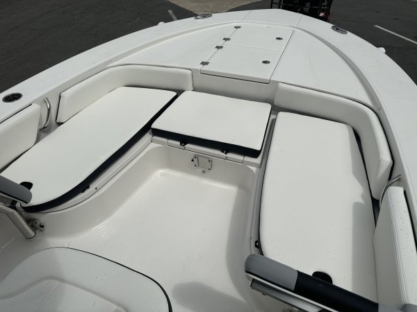 The definition of an outboard motor is a detachable engine mounted on outboard brackets on the stern of your boat.  This configuration will have only one single engine.