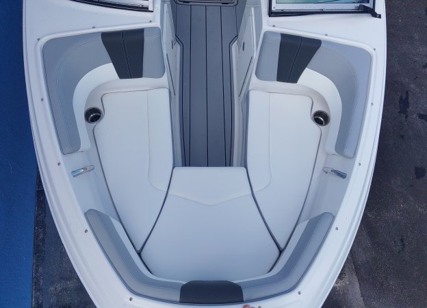 Glass fibers either loose or woven, reinforced with resin and used in the construction of many boats.