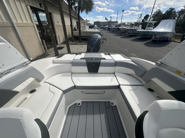 A dual console boat is typically one that was designed for salt water fishing and has the console split around a center walk thru to the bow.  The helm is usually starboard while there is passenger seating to port.