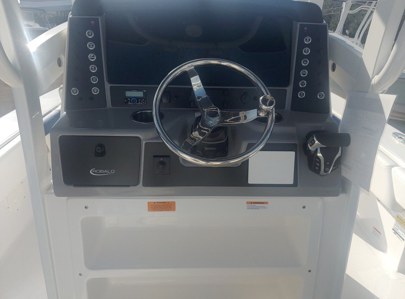 The definition of an outboard motor is a detachable engine mounted on outboard brackets on the stern of your boat.  This configuration will have only one single engine.