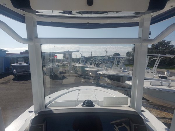 The definition of an outboard motor is a detachable engine mounted on outboard brackets on the stern of your boat.  This configuration will have only one single engine.