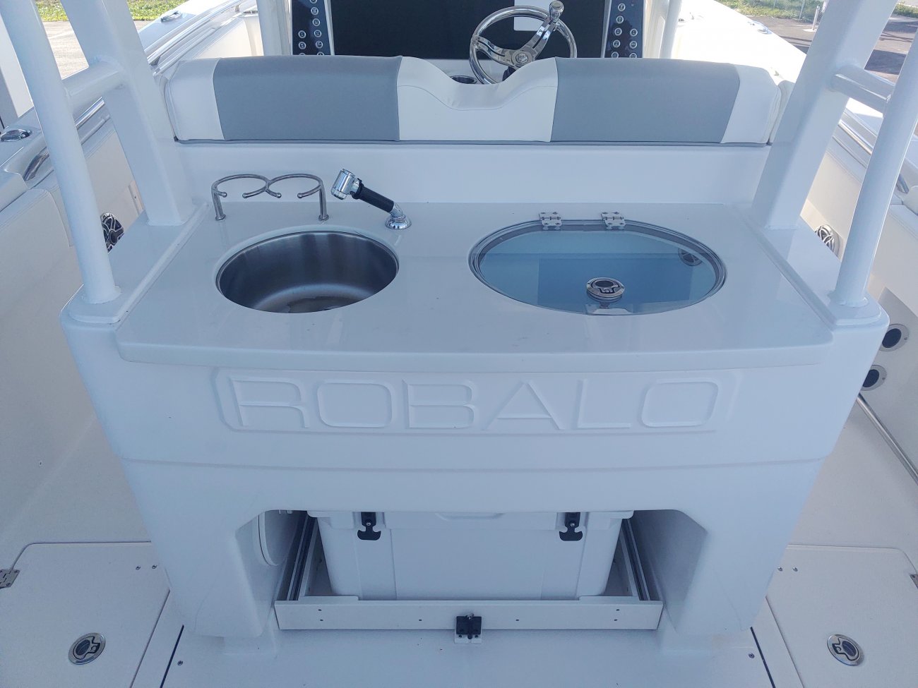 Center console is an open hull boat where the console of the boat is in the center. The boat deck surrounds the console so that a person can walk all around the boat from stern to bow with ease. Most center consoles are powered by outboard motors.