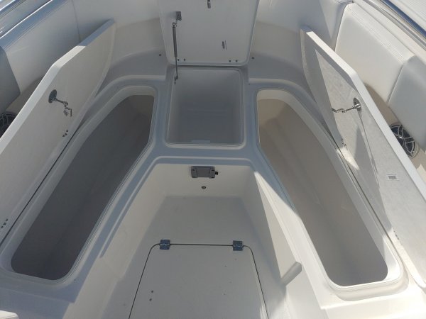 Glass fibers either loose or woven, reinforced with resin and used in the construction of many boats.