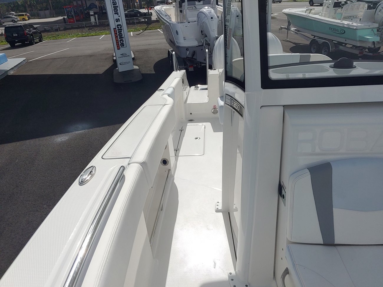Center console is an open hull boat where the console of the boat is in the center. The boat deck surrounds the console so that a person can walk all around the boat from stern to bow with ease. Most center consoles are powered by outboard motors.