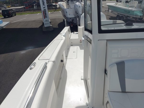 Center console is an open hull boat where the console of the boat is in the center. The boat deck surrounds the console so that a person can walk all around the boat from stern to bow with ease. Most center consoles are powered by outboard motors.