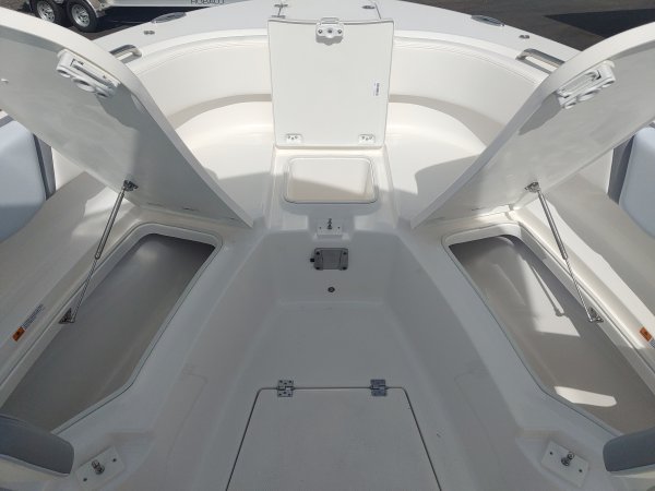 Glass fibers either loose or woven, reinforced with resin and used in the construction of many boats.