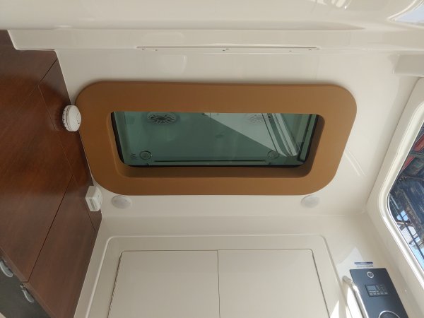 Glass fibers either loose or woven, reinforced with resin and used in the construction of many boats.