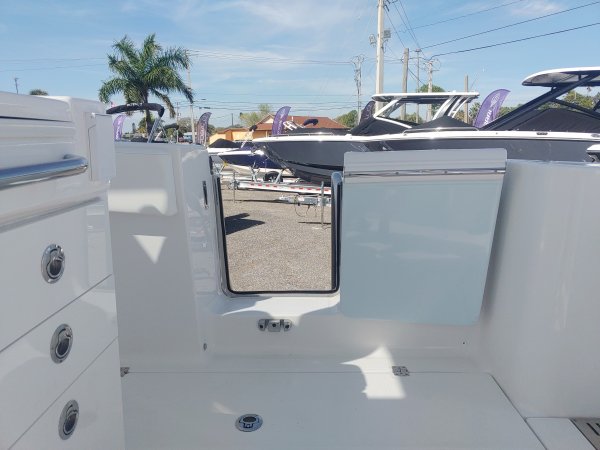 Generally, a Sportfisherman will be a large craft with a fly bridge and outriggers designed to pursue big game fish.  These will be 35 feet up in length and contain all of the amenities to handle heavy blue water.