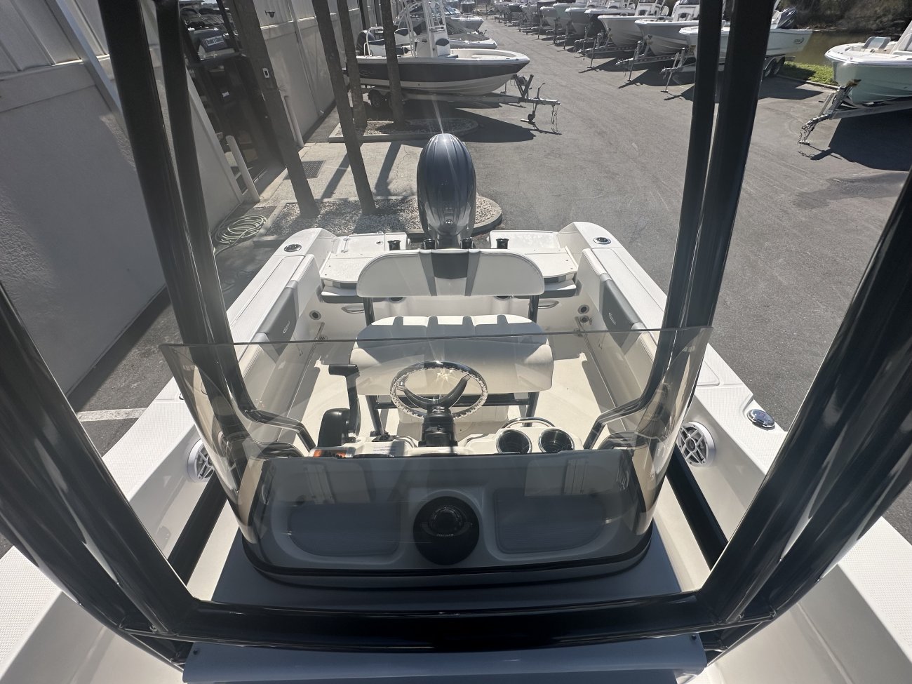 The definition of an outboard motor is a detachable engine mounted on outboard brackets on the stern of your boat.  This configuration will have only one single engine.