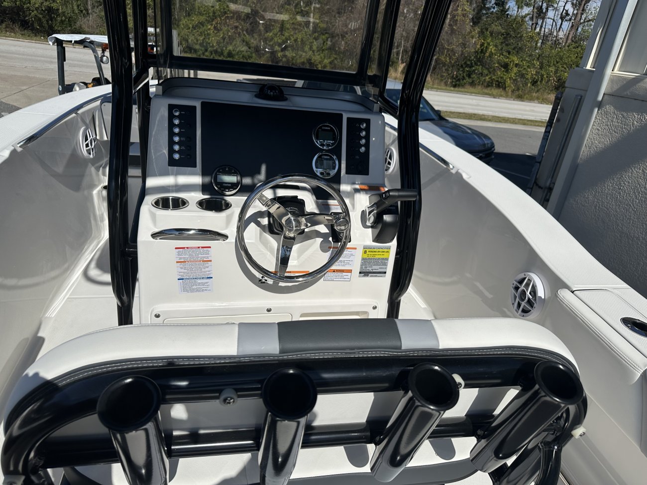 Glass fibers either loose or woven, reinforced with resin and used in the construction of many boats.