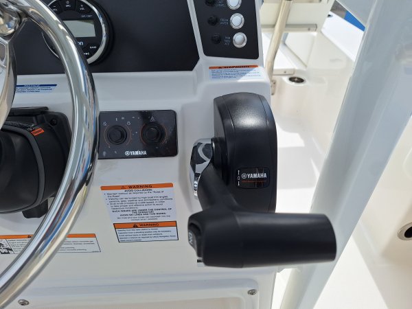 The definition of an outboard motor is a detachable engine mounted on outboard brackets on the stern of your boat.  This configuration will have only one single engine.