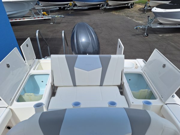 The definition of an outboard motor is a detachable engine mounted on outboard brackets on the stern of your boat.  This configuration will have only one single engine.