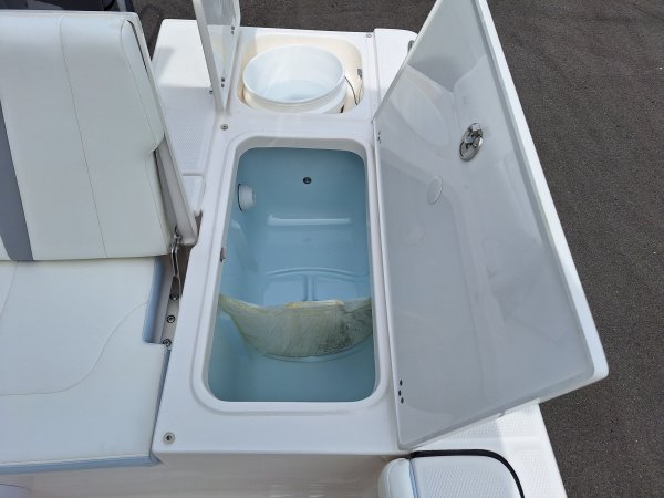 Glass fibers either loose or woven, reinforced with resin and used in the construction of many boats.