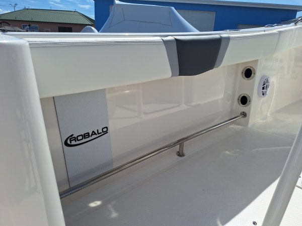 The definition of an outboard motor is a detachable engine mounted on outboard brackets on the stern of your boat.  This configuration will have only one single engine.
