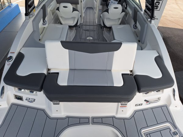 The definition of an outboard motor is a detachable engine mounted on outboard brackets on the stern of your boat.  This configuration will have only one single engine.