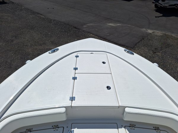 Center console is an open hull boat where the console of the boat is in the center. The boat deck surrounds the console so that a person can walk all around the boat from stern to bow with ease. Most center consoles are powered by outboard motors.